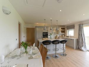 a kitchen and dining room with a table and chairs at The Old Kennels in Tibberton