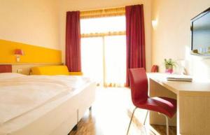 Voodi või voodid majutusasutuse Garda Sporting Club Hotel toas