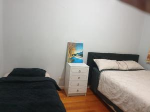 Postel nebo postele na pokoji v ubytování Homestay near Dandenong Plaza