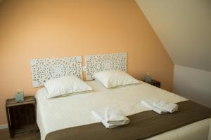 Postel nebo postele na pokoji v ubytování Gîte Chez Tim
