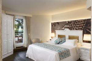 Кровать или кровати в номере Hotel Abi d'Oru