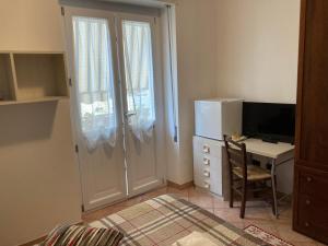 TV a/nebo společenská místnost v ubytování B&B Marsiglia + 8 fotografií