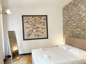 A bed or beds in a room at Pantheon Rome Relais