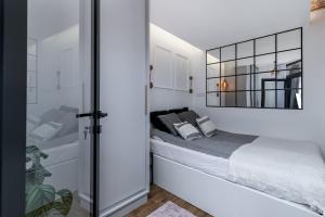 Posteľ alebo postele v izbe v ubytovaní Premium Apartment with Air Conditioning, city heart in Cracow