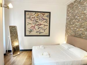 A bed or beds in a room at Pantheon Rome Relais