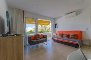Posezení v ubytování Holiday apartment with direct sea promenade access