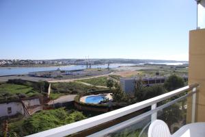 a view from the balcony of a condo with a pool at Apartamento Arade Portimao in Portimão