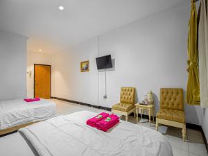 Posteľ alebo postele v izbe v ubytovaní Hotel Cempaka Sari