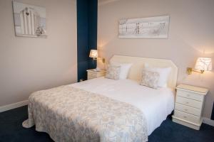 Postel nebo postele na pokoji v ubytování First Euroflat Hotel