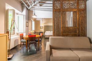 a living room with a couch and a table at Firenze Rentals Accademia in Florence