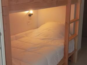 a bedroom with a bunk bed with white sheets at Studio aux Arcs 1800 avec Balcon, 4 Couchages, Vue Mont Blanc - FR-1-346-308 in Arc 1800