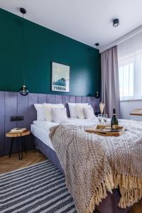 Posteľ alebo postele v izbe v ubytovaní APARTAMENTY NOVA BIAŁKA