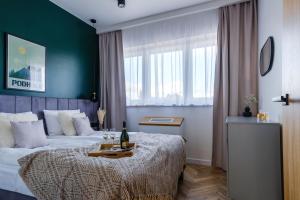 Posteľ alebo postele v izbe v ubytovaní APARTAMENTY NOVA BIAŁKA