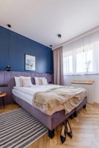 Posteľ alebo postele v izbe v ubytovaní APARTAMENTY NOVA BIAŁKA
