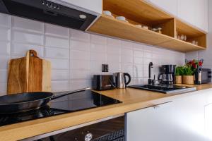 Kuchyňa alebo kuchynka v ubytovaní APARTAMENTY NOVA BIAŁKA