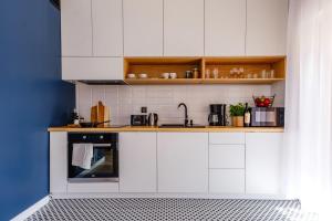 Kuchyňa alebo kuchynka v ubytovaní APARTAMENTY NOVA BIAŁKA