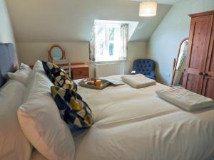 Säng eller sängar i ett rum på Granary Cottage