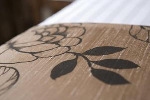 a close up of a wooden table with leaves on it at Buchan Braes Hotel in Peterhead