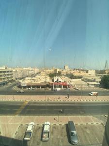 a view of a parking lot with cars parked at Burj Alawal in Al Jubail