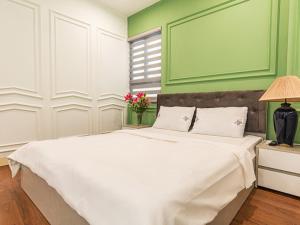 Postel nebo postele na pokoji v ubytování Madelise Max Hotel