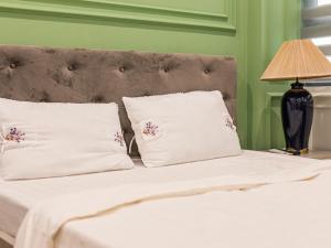Postel nebo postele na pokoji v ubytování Madelise Max Hotel