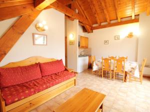 a living room with a couch and a dining room at Appartement Aussois, 3 pièces, 6 personnes - FR-1-508-88 in Aussois