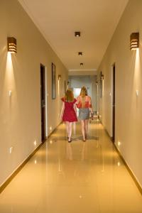 two women walking down a hallway in a hospital at Mount Rich Rumassala By JMS Group in Unawatuna +92 photos