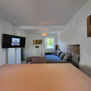 Ένα ή περισσότερα κρεβάτια σε δωμάτιο στο Ferienwohnung NR1