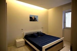 Postel nebo postele na pokoji v ubytování Nina Casa Vacanze
