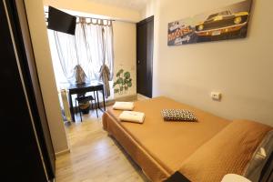 A bed or beds in a room at Guest House Minas