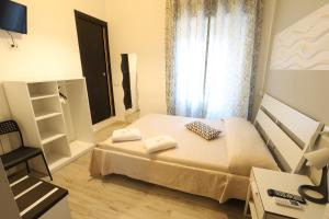 A bed or beds in a room at Guest House Minas