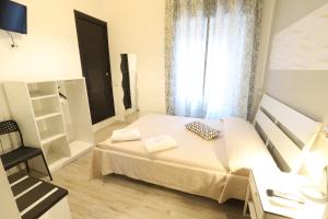 A bed or beds in a room at Guest House Minas