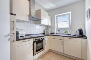 O bucătărie sau chicinetă la Zinnowitz, Ferienwohnung Sanddorn