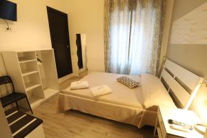 A bed or beds in a room at Guest House Minas