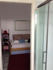 Postel nebo postele na pokoji v ubytování A Casa di Ilaria