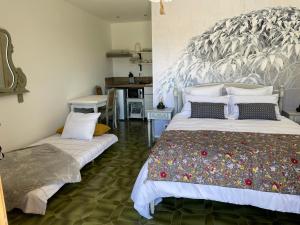 Llit o llits en una habitació de CARLIN Ferme Haute Prairie