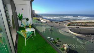 a balcony with a view of the ocean from a building at Sea View B16 - Mosqué Hassan II - By TheCasaEdition in Casablanca