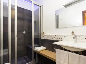 a bathroom with a sink and a shower at Central Rooms Il Re in Catania
