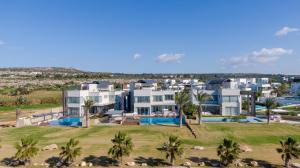 an aerial view of a house with palm trees at Vivo Mare Beachfront-Seaview Villas in Ayia Napa