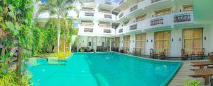 a swimming pool in the middle of a building at Nil Diya Beach Resort in Matara