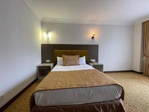 Ліжко або ліжка в номері SEFA HOTEL 1 ÇORLU