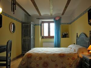 a bedroom with a bed and a window at Araiztar in Irañeta