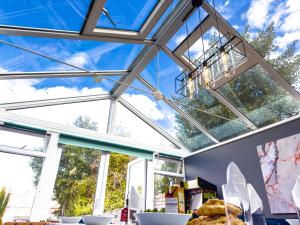 a glass ceiling in a room with windows at Stunning House Free Parking Garden WiFi in Bristol