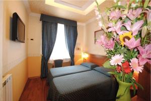 Posteľ alebo postele v izbe v ubytovaní Hotel Verona Rome