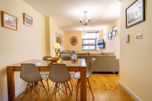 a dining room and living room with a table and chairs at 316 Westgate in York