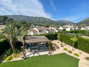 an overhead view of a garden with a gazebo at Stunning mountain views! Private Villa with fabulous communal pool! in Murla