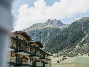 a mountain view from a hotel in the mountains at VAYA Residence Galtür Paznaun in Galtür