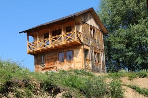 a house being constructed on top of a hill at Gutsulochka Apartment in Yaremche