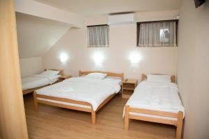 Postel nebo postele na pokoji v ubytování Motel Imperija