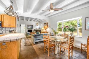 a kitchen and dining room with a table and chairs at Mendocino Dunes - Sand Dollar in Fort Bragg